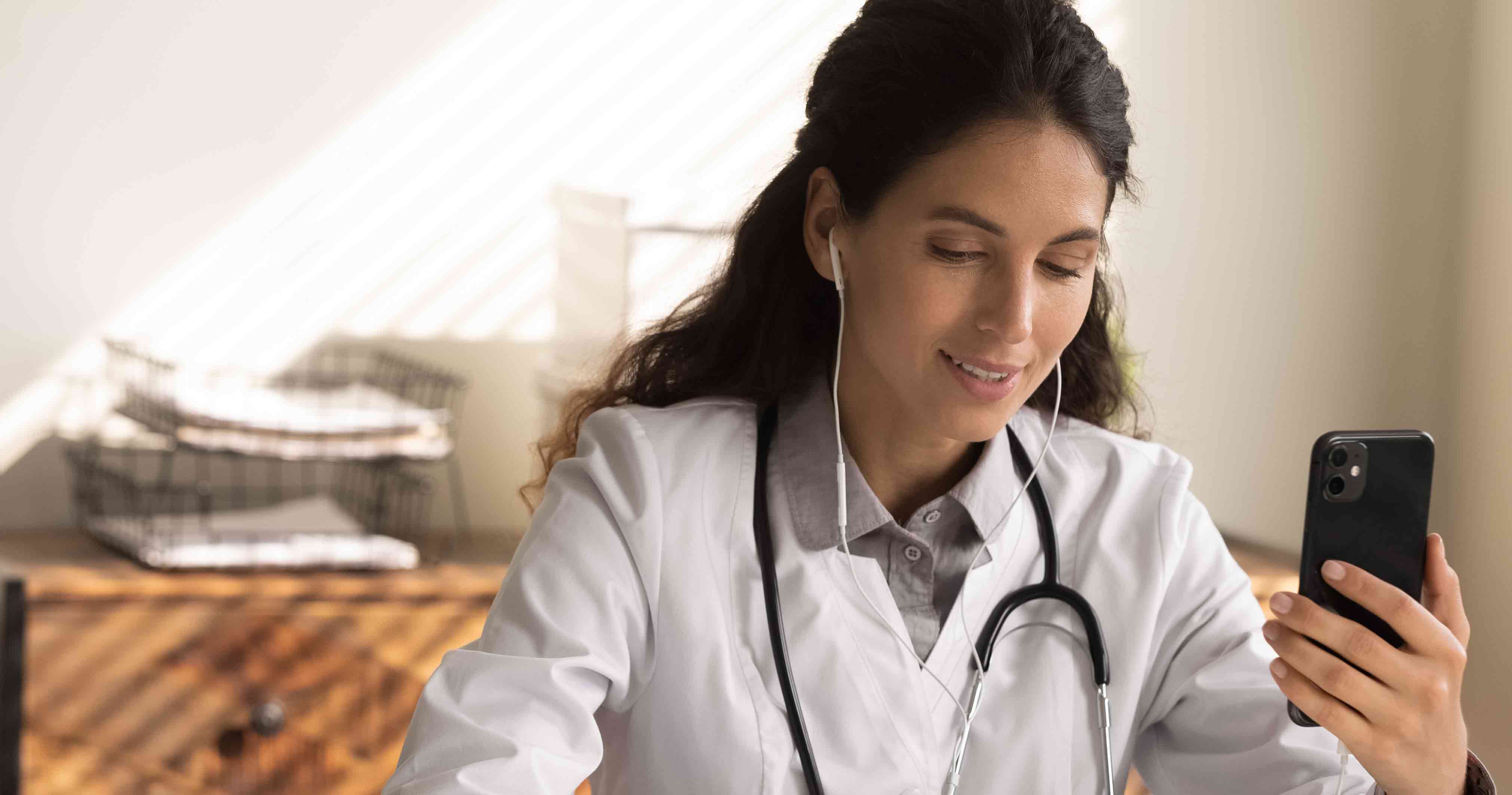 Doctor on the phone taking notes