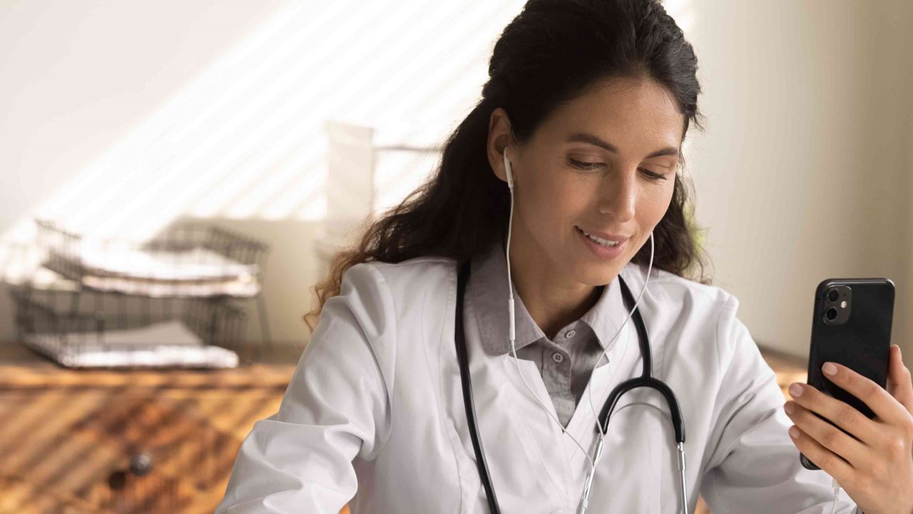 Doctor on the phone taking notes