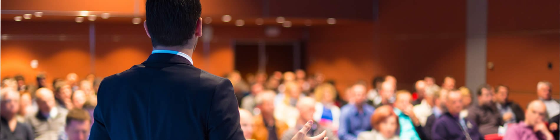 Man presenting to audience.