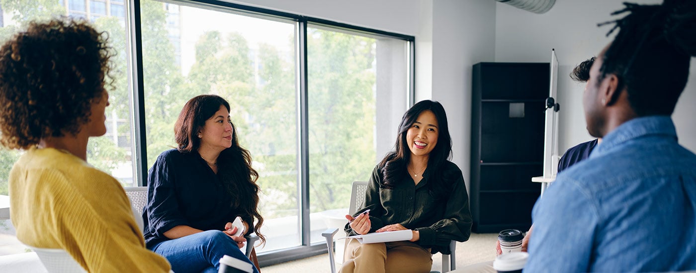 colleagues talking in a circle