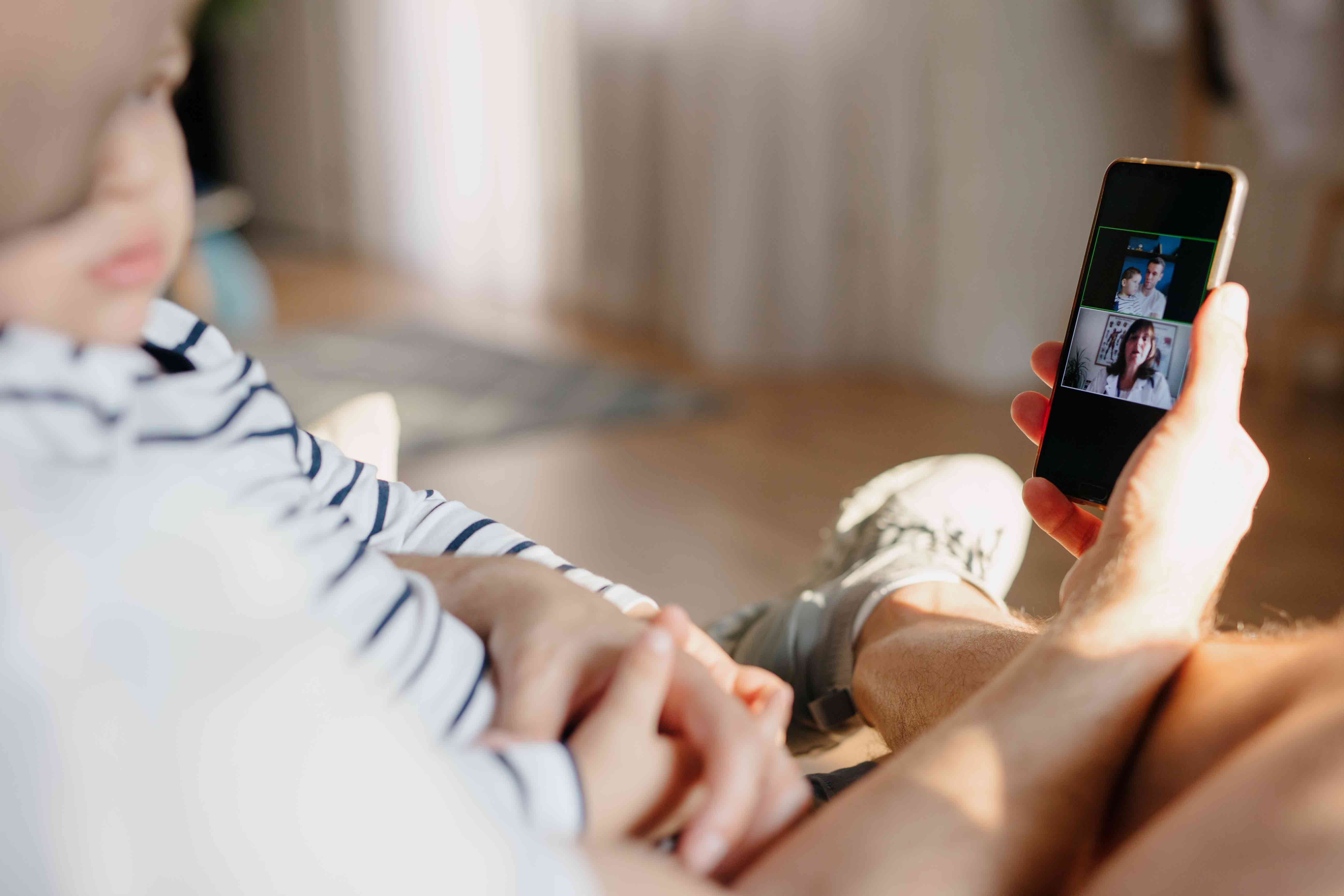 man-and-baby-on-mobile-video-call