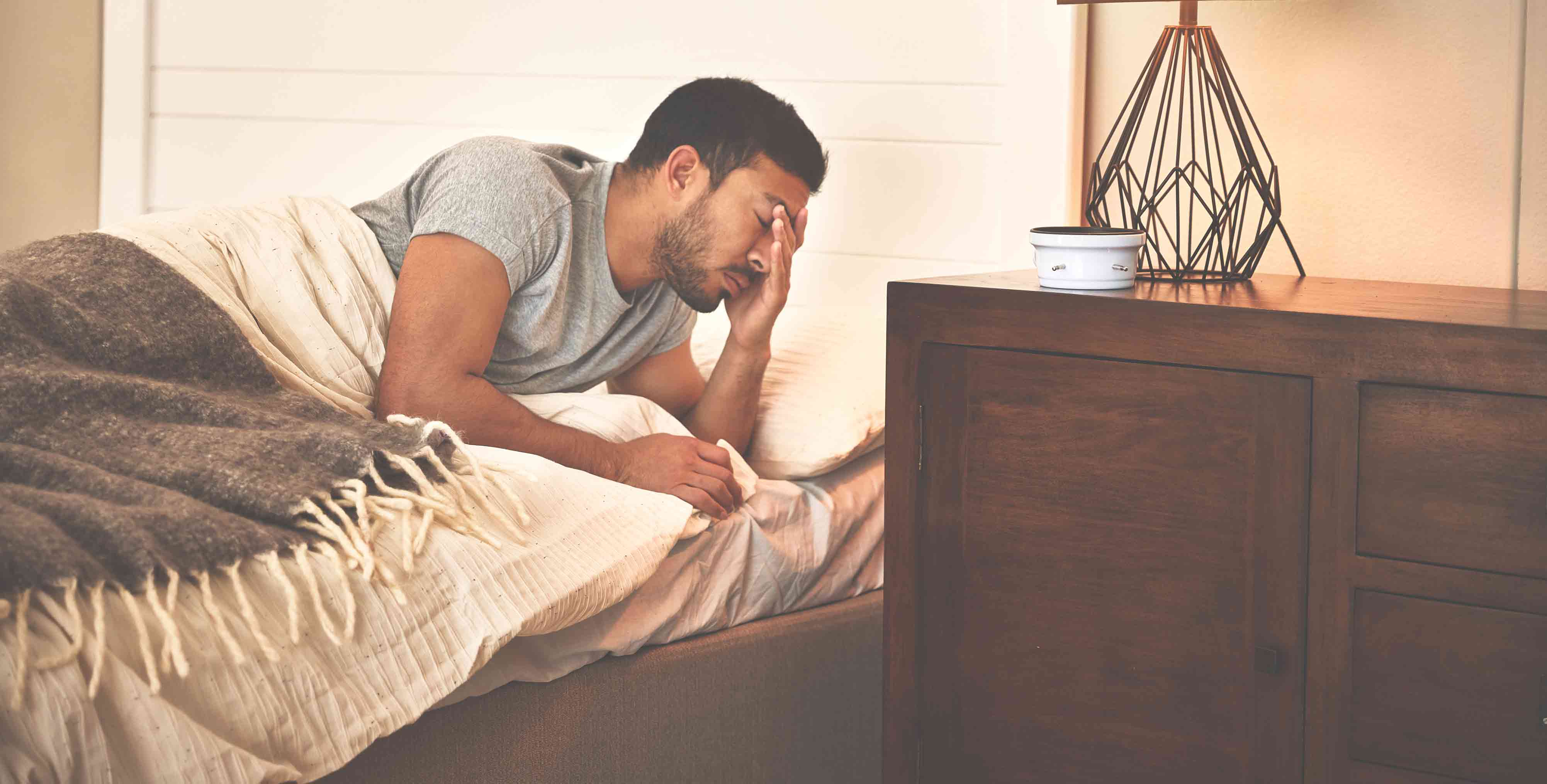 Man-in-bed-struggling-to-sleep