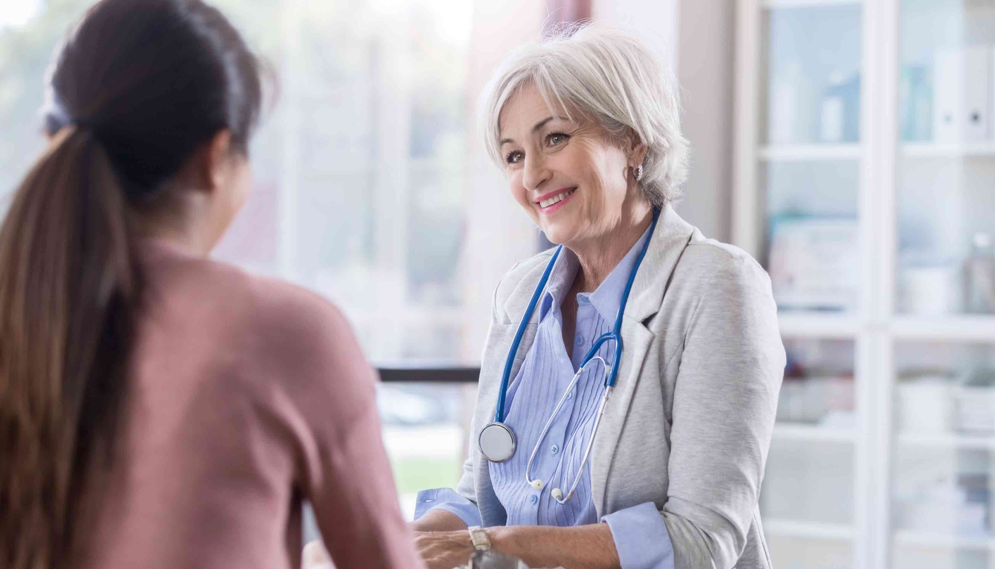 Woman-consulting-with-doctor