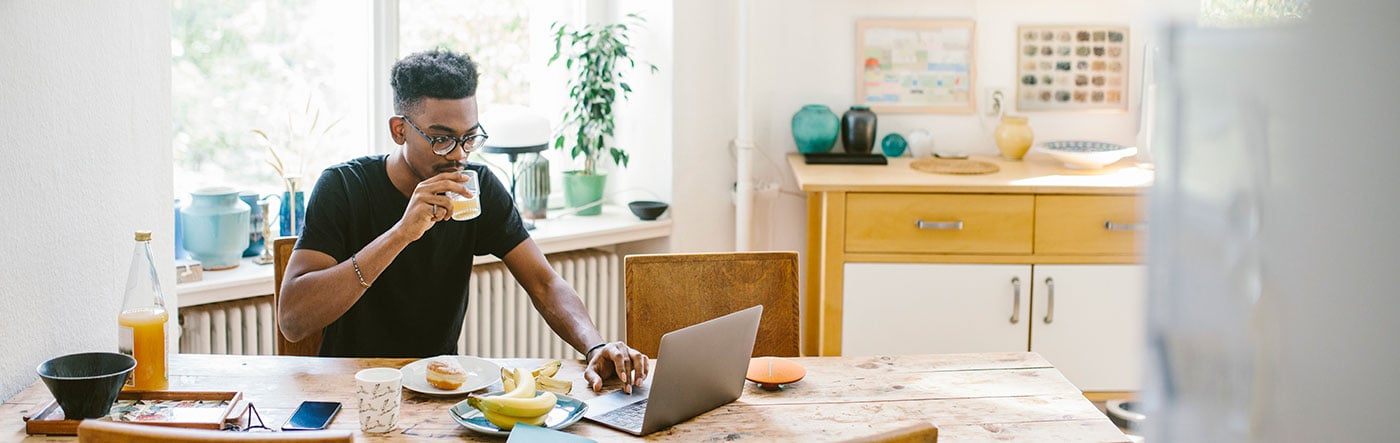 remote worker eating breakfast at home