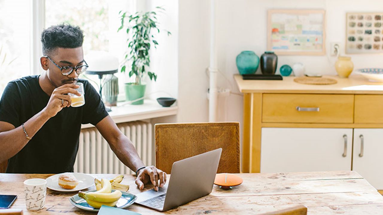 remote worker eating breakfast at home