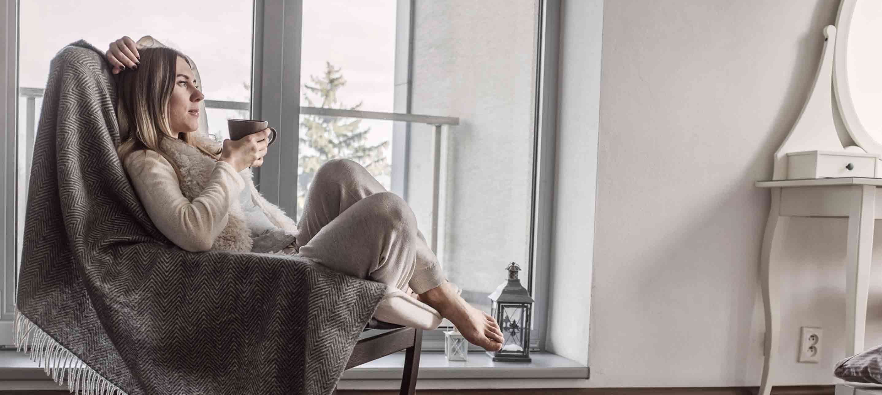 woman-sitting-in-cozy-chair