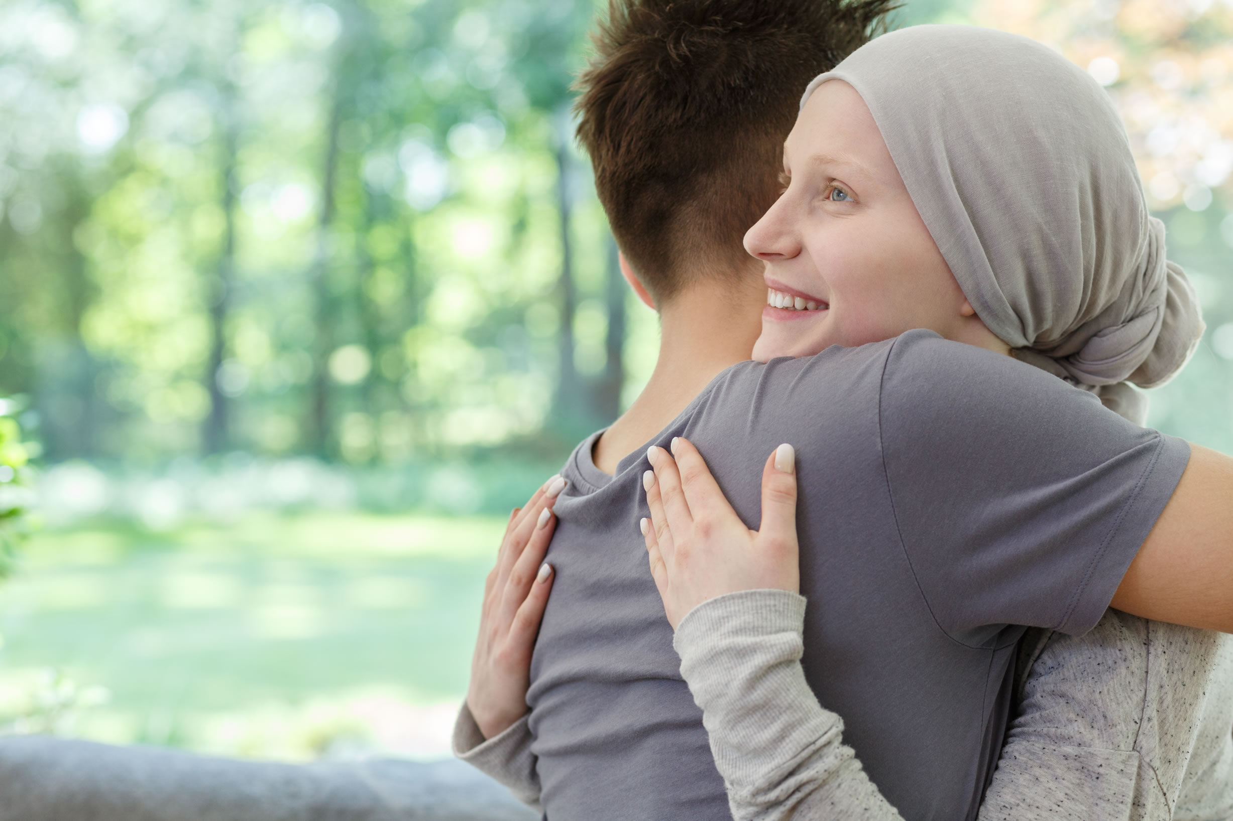 Cancer patient being hugged