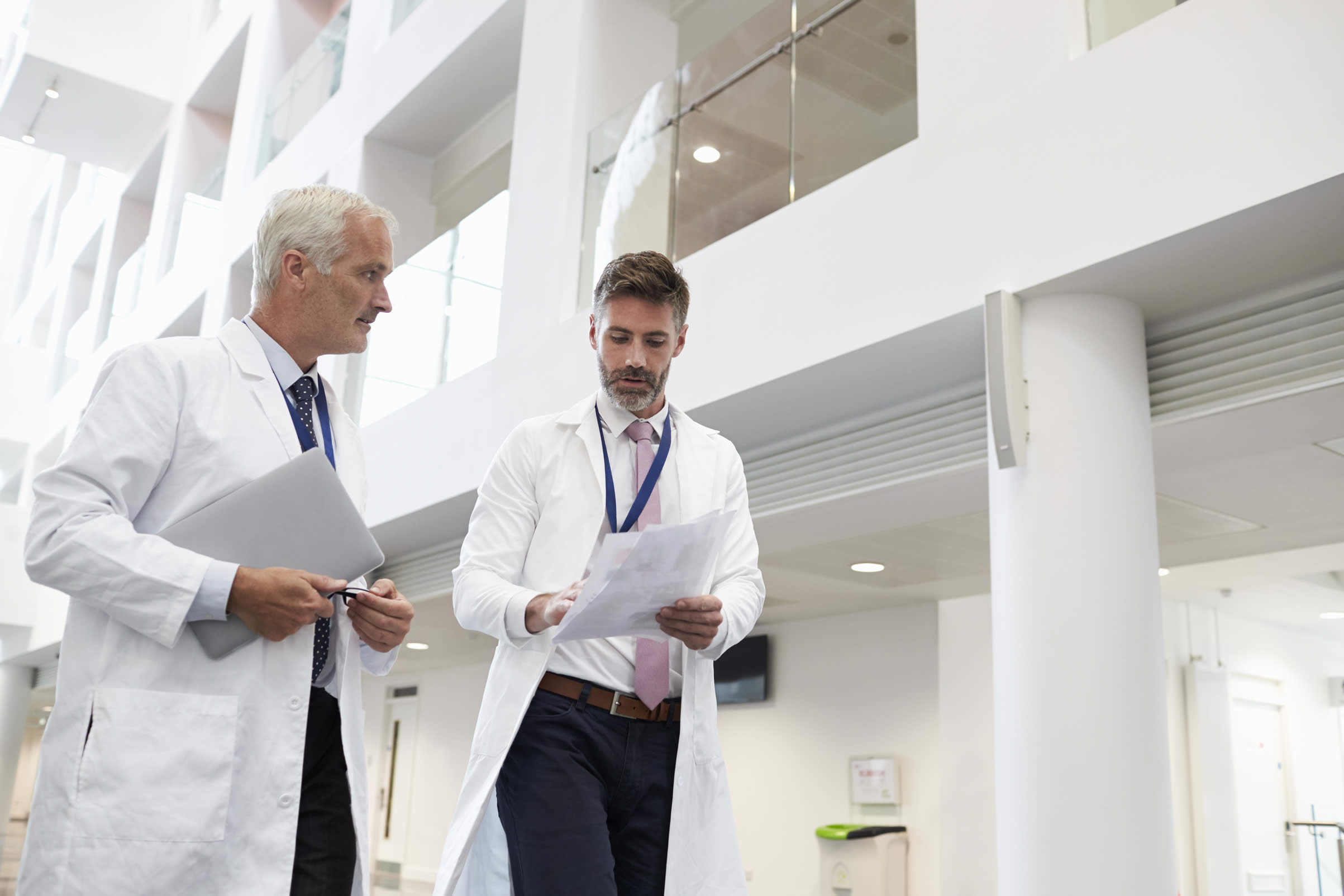 Doctors walking down hospital corridor