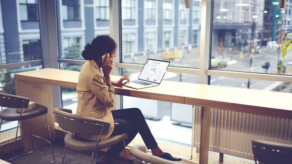 Lady on the phone at her desk