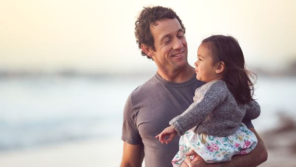 Father and daughter on the beach