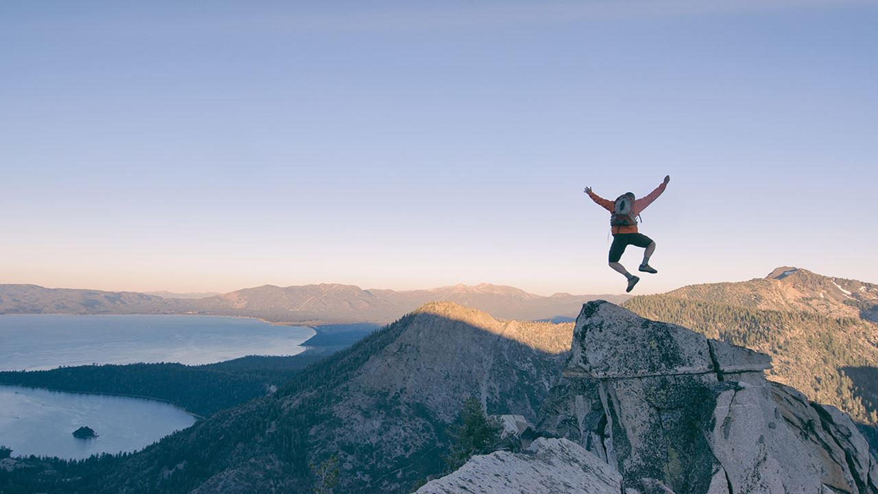 Man leaping on mountain