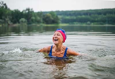Woman swimming in lake