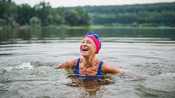 Woman swimming in lake