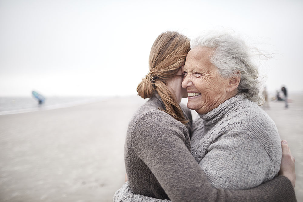 Family members embracing at beach