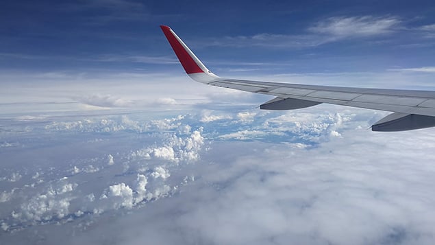 Tail of plane in the sky