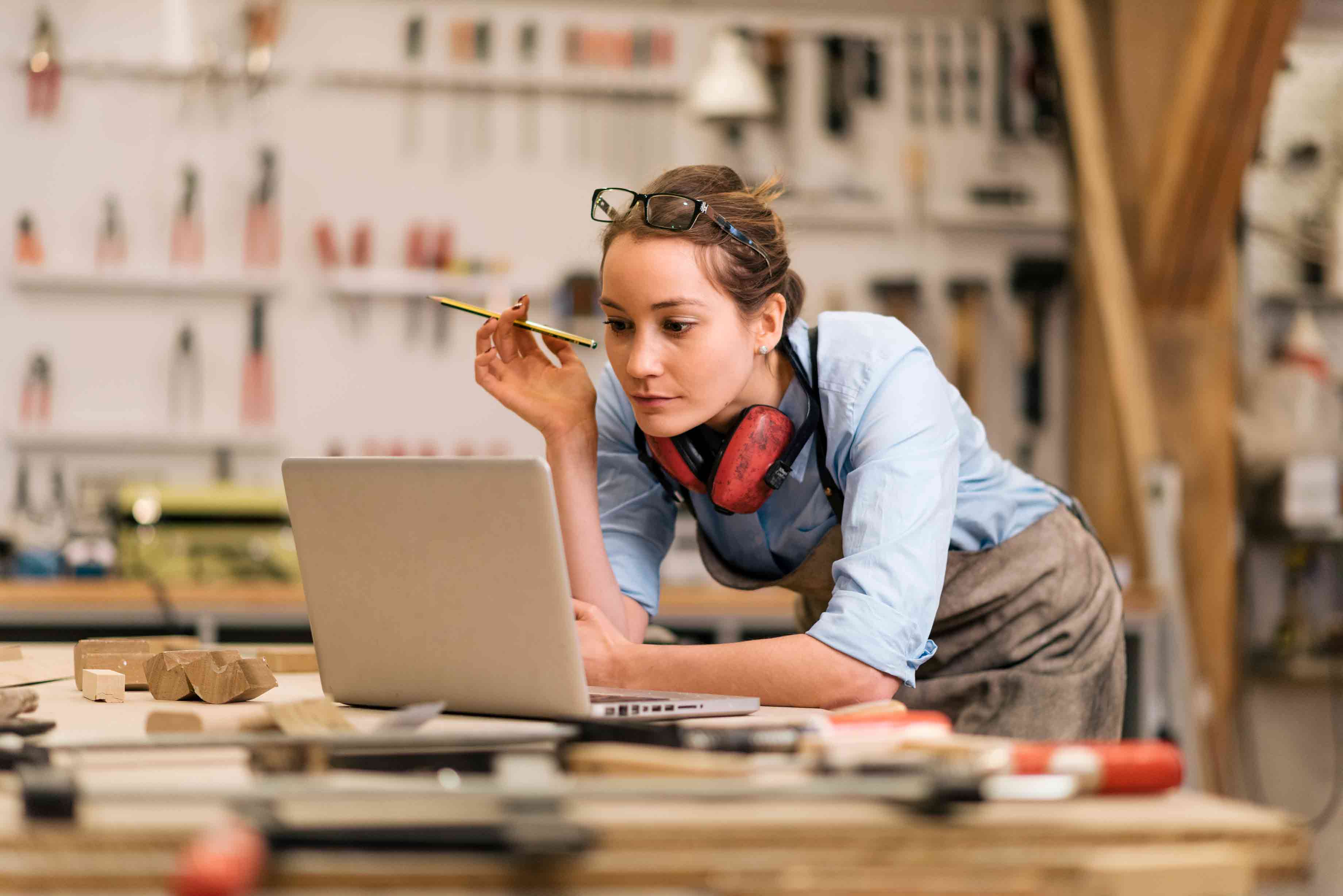 Woman thinking in workshop