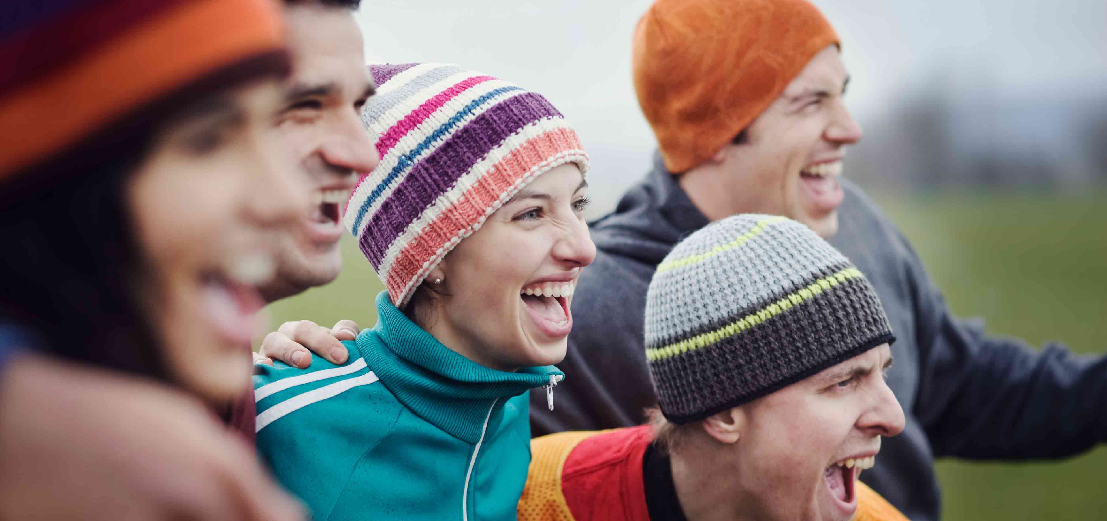 group of friends in colourful beanies