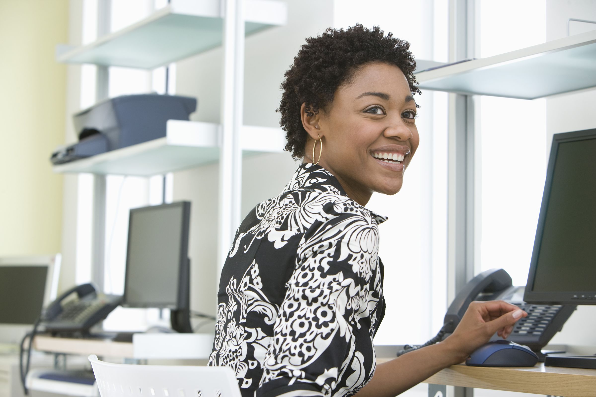 Smiling lady at her work desk