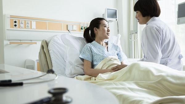 Doctor at patient's bedside