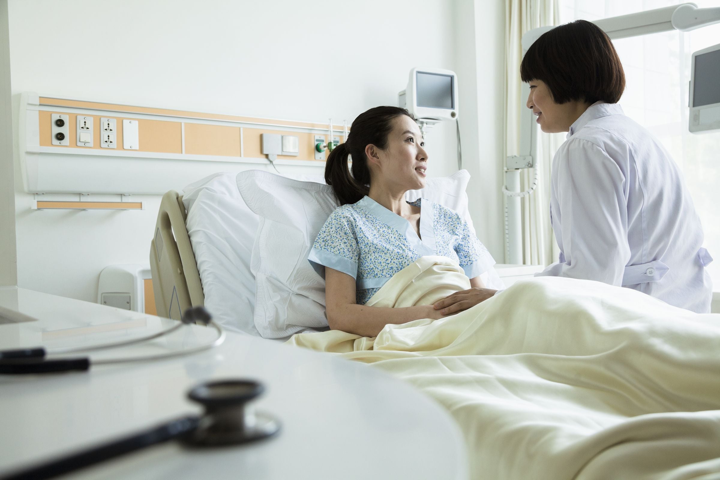 Doctor at patient's bedside