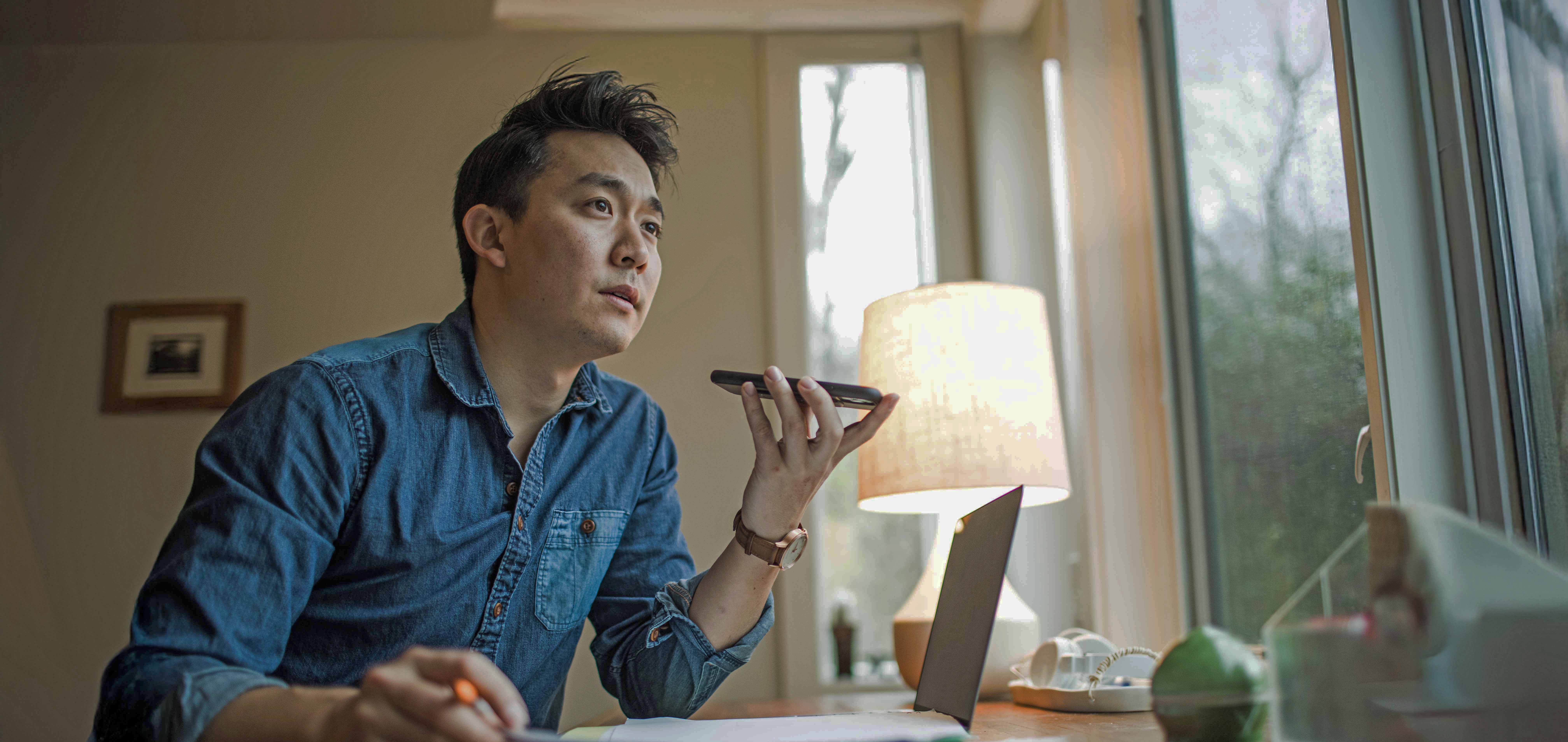 Man using laptop and mobile phone.jpg