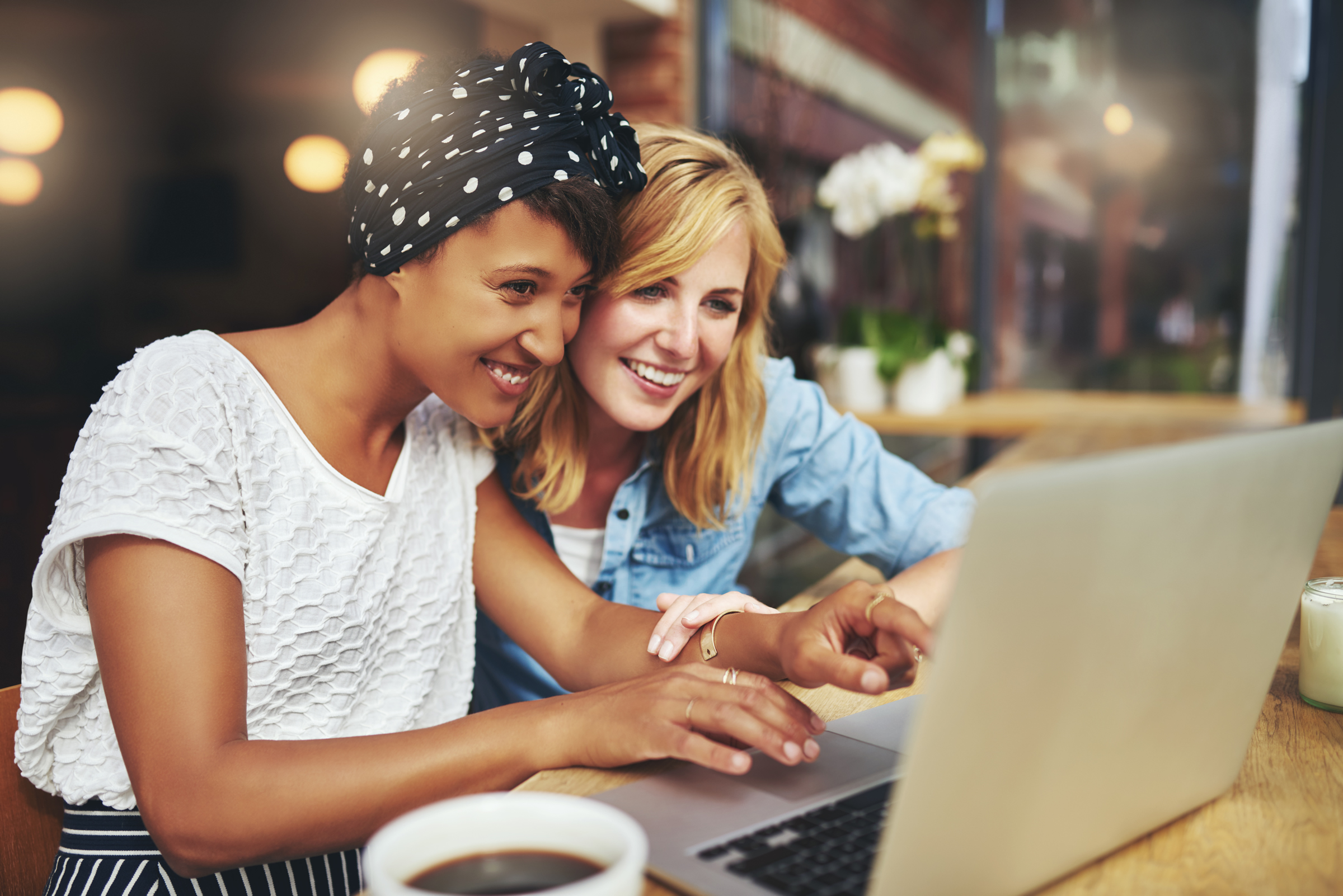 friends looking at laptop