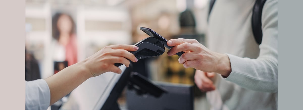tapping phone on card reader to make a payment using NFC