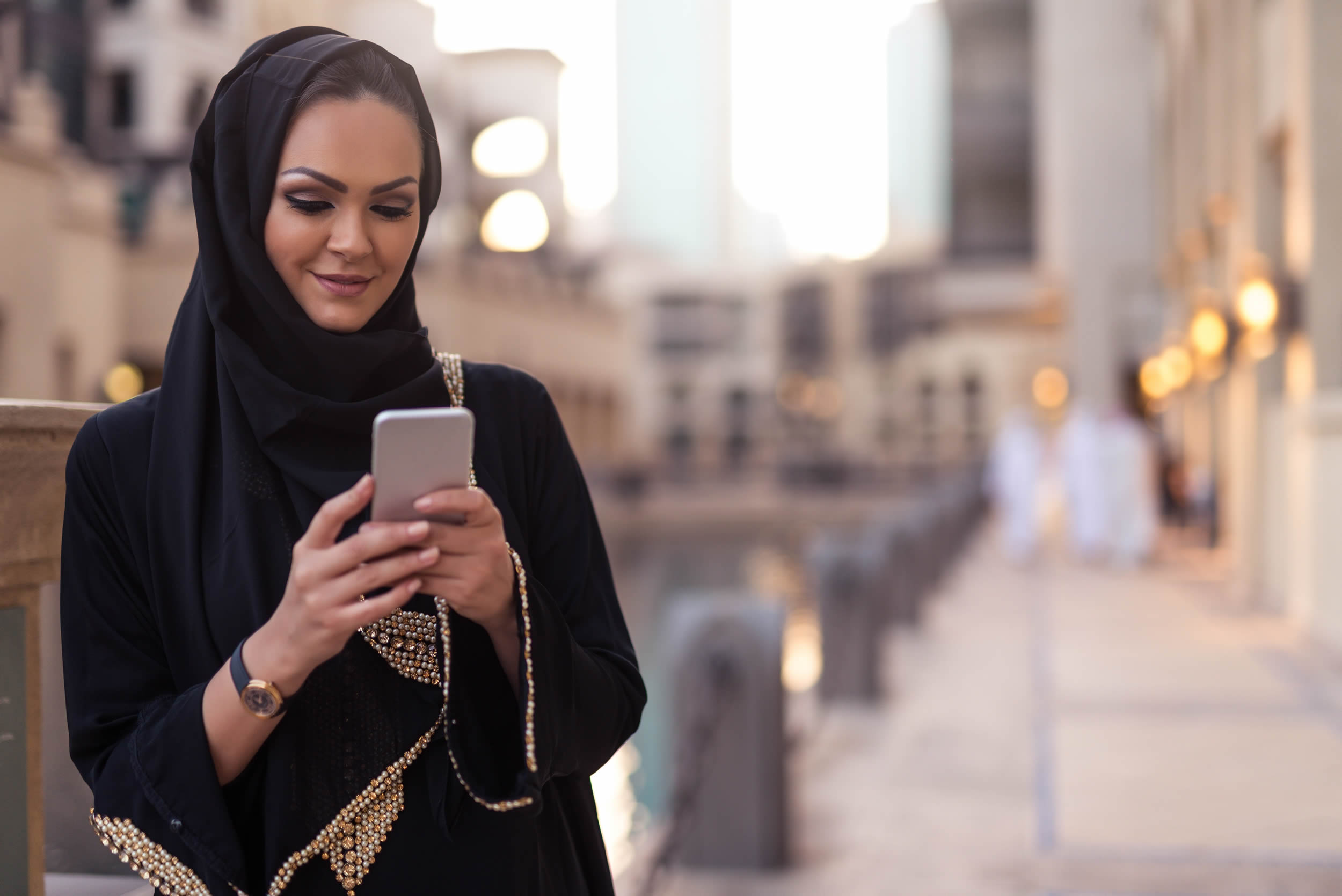 Smiling lady looking at phone