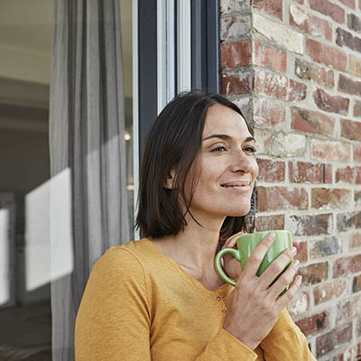 Smiling lady with tea