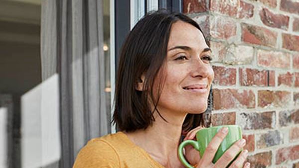 Smiling lady with tea