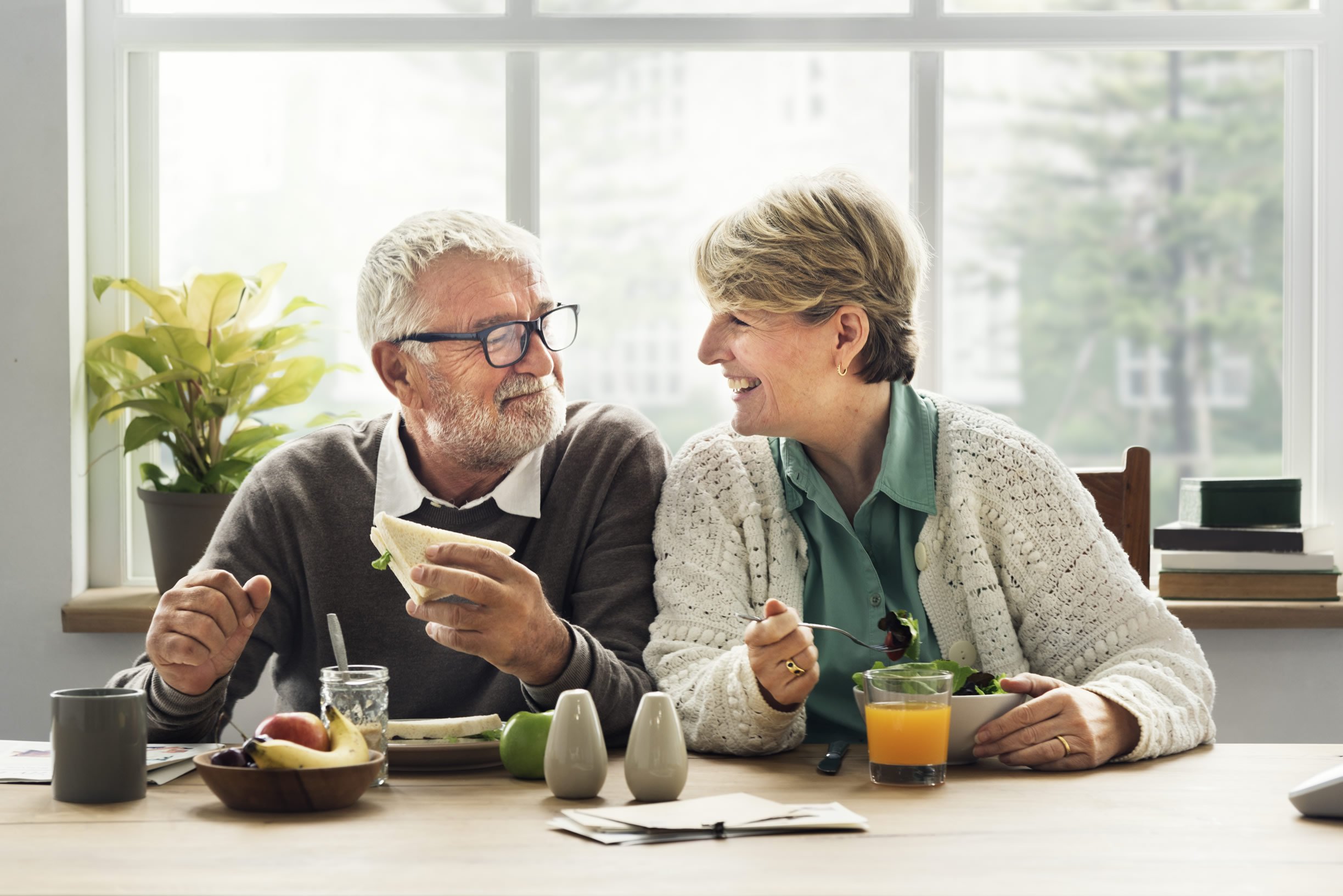 Smiling couple having lunch