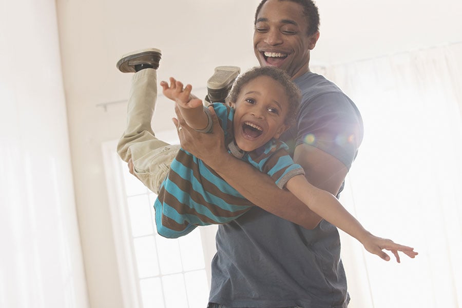 Man playing with his son