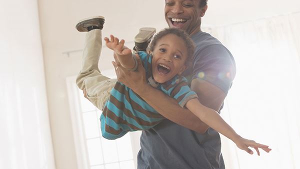 Man playing with his son