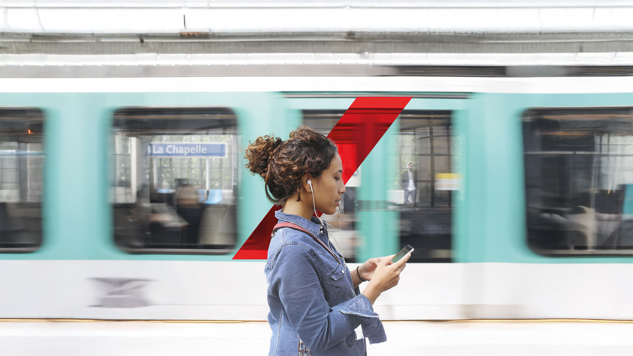 Red Switch - A young woman with a smartphone in the subway of Paris