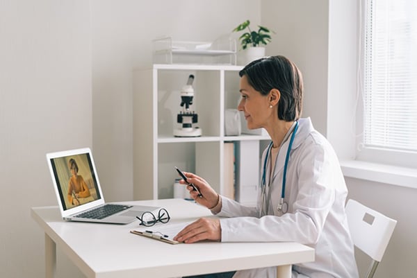 female doctor virtually talking to patient