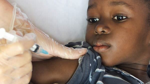 Young boy receiving an injection