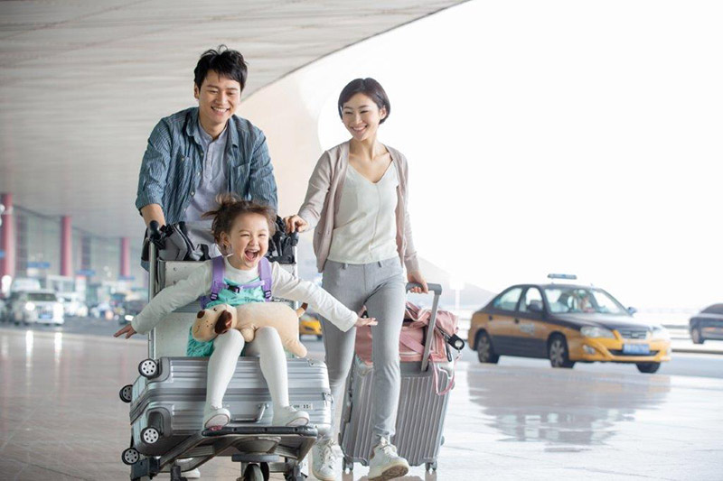 family walking in airport