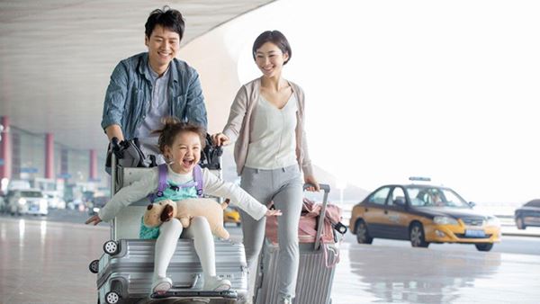 family walking in airport