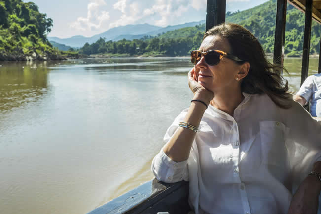 Contented lady on a sunny boat trip