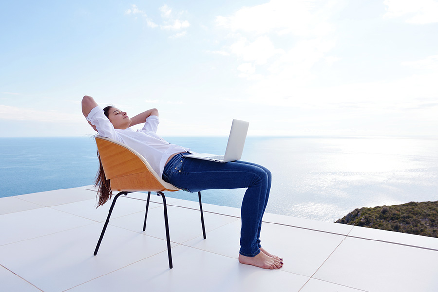 man relaxed working on a laptop