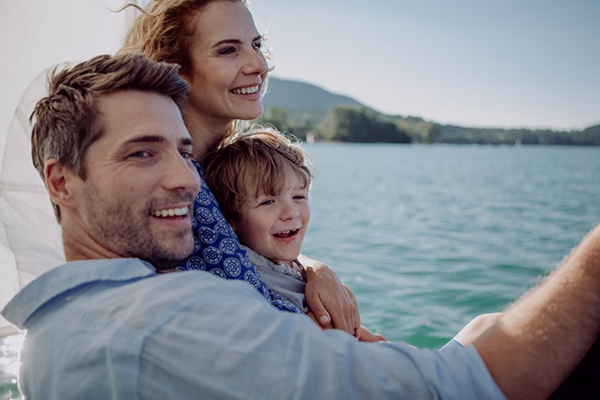 family taking a picture at sea