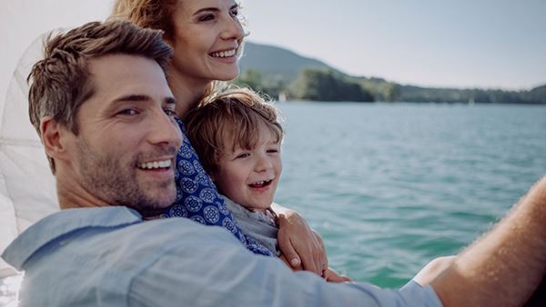 family taking a picture at sea