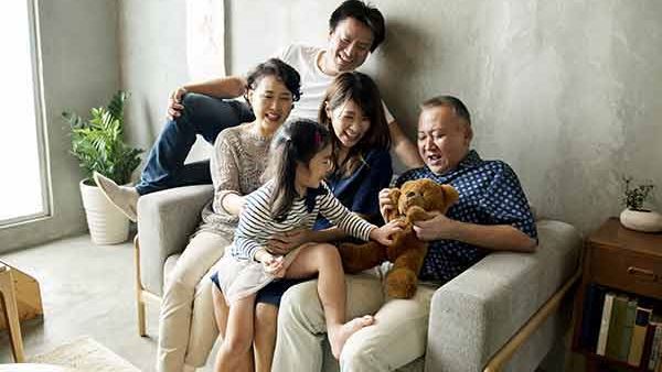 family sitting on couch