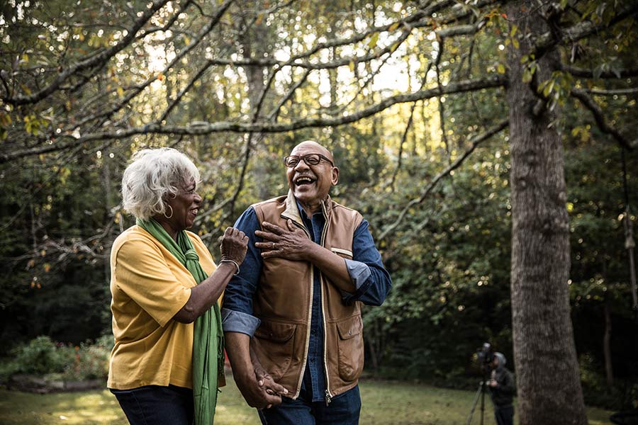 RetiredCoupleWalkingInForest