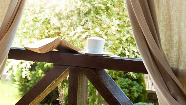 book and cup of tea outside