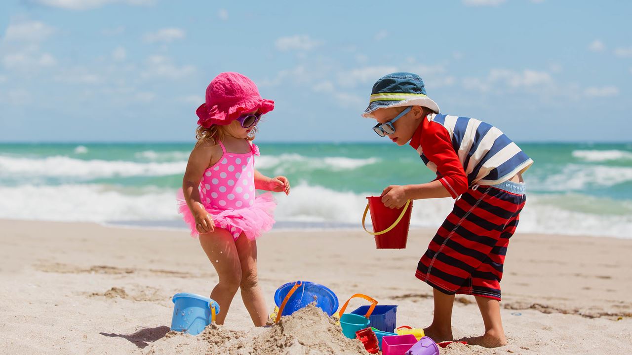 Children playing on sandy beach