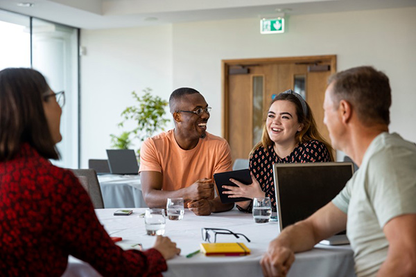 smiling colleagues in office
