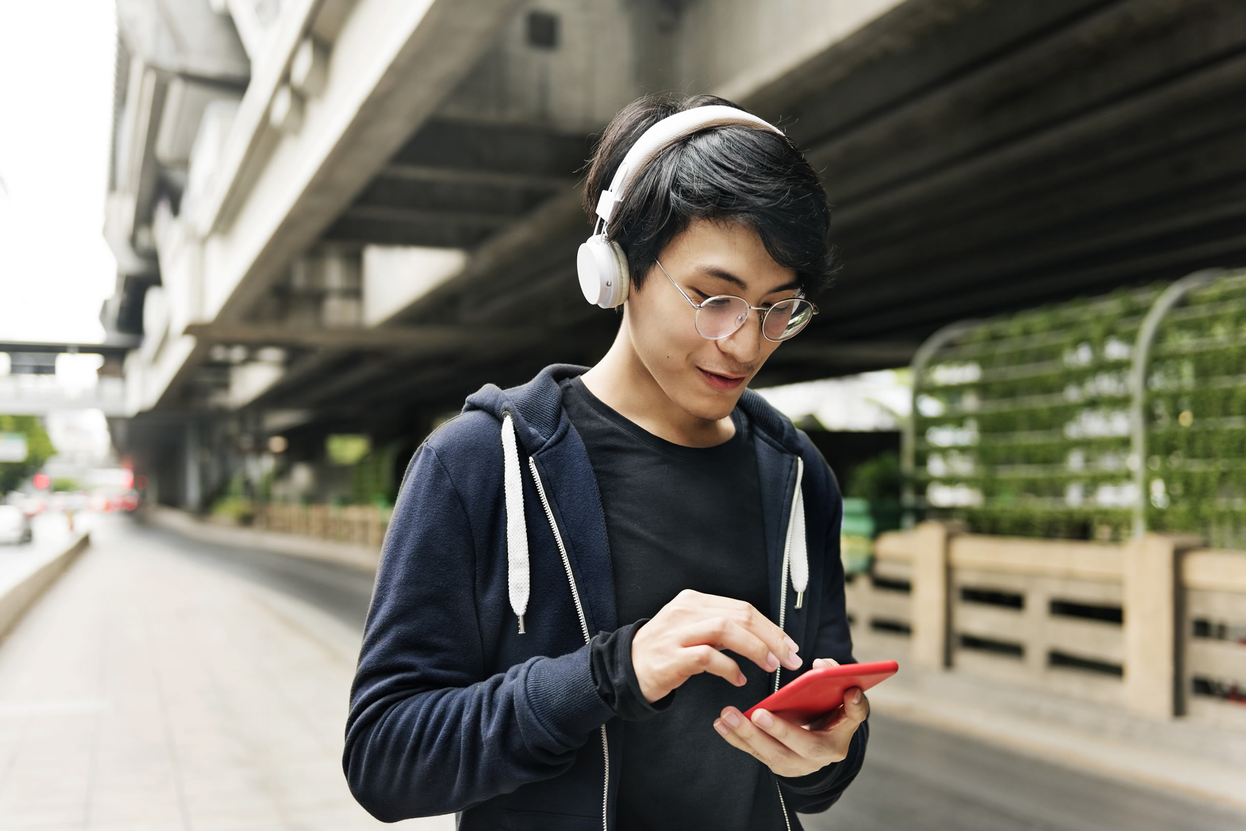 Man listening to music and looking at phone