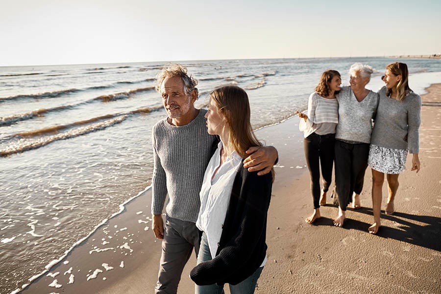 Family walking on beach