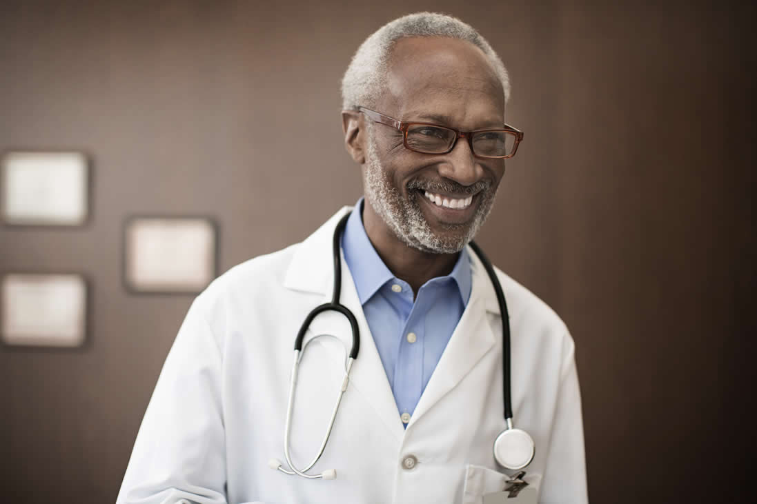 doctor smiling wearing stethoscope